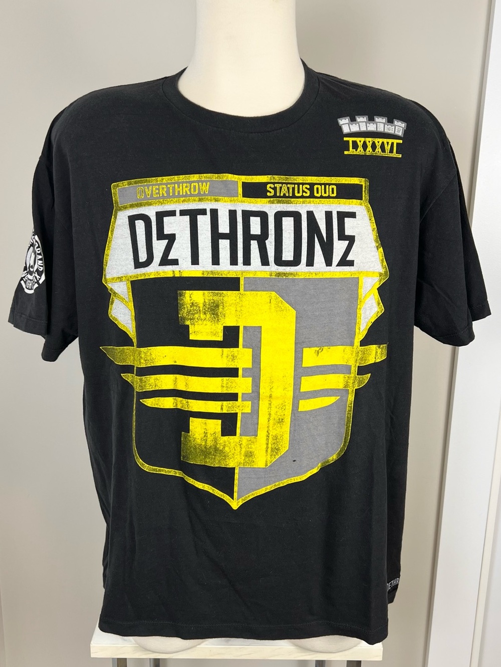 Vintage Y2K Black Graphic Tee with Yellow & Gray Shield